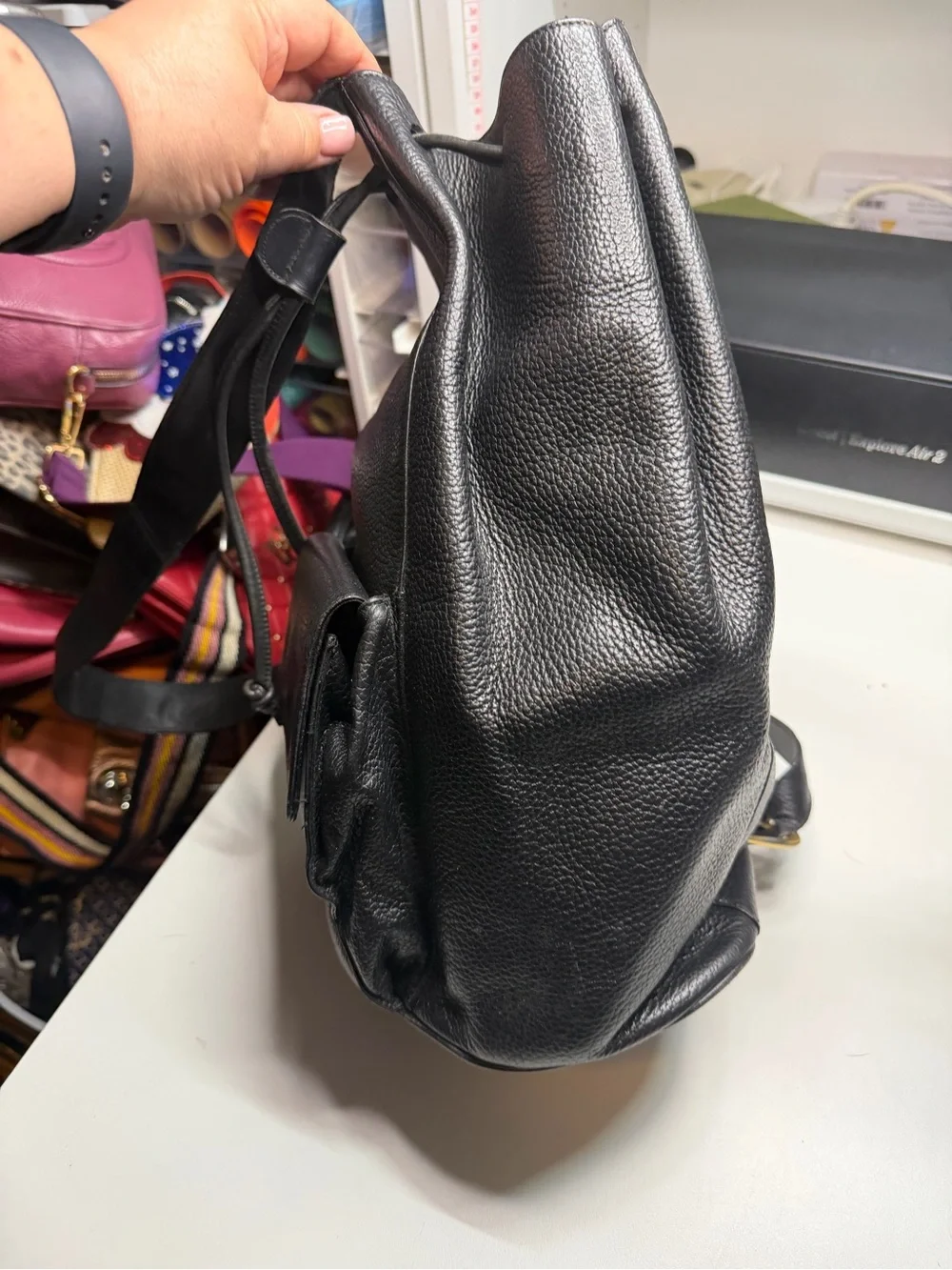 Salvatore Ferragamo Black Pebbled Leather Drawstring Sling Backpack